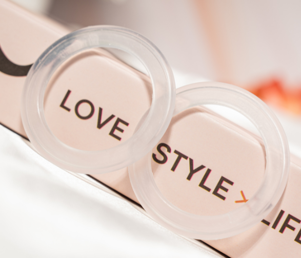 Close-up of O-Feel silicone rings printed with Love, Style, Life